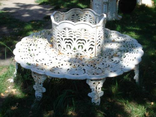 Coalbrookdale style iron tree bench